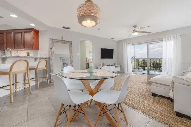 a dining room with a table and chairs