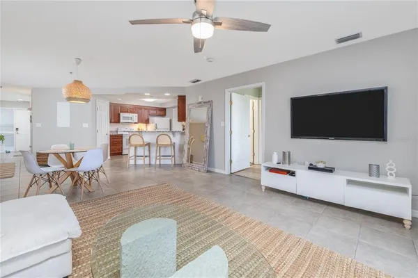 a kitchen with stainless steel appliances granite countertop a refrigerator stove a sink and dishwasher