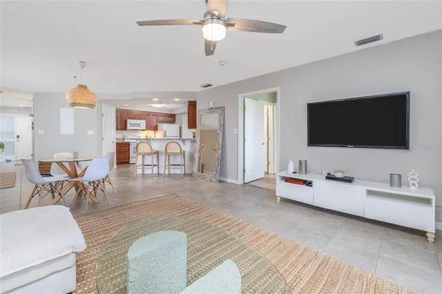 a kitchen with stainless steel appliances granite countertop a refrigerator stove a sink and dishwasher