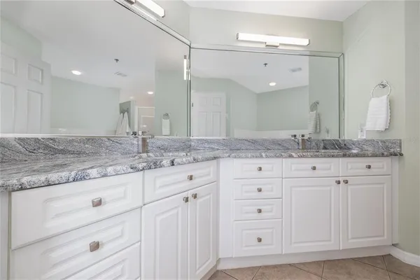 a white bath tub sitting next to a toilet