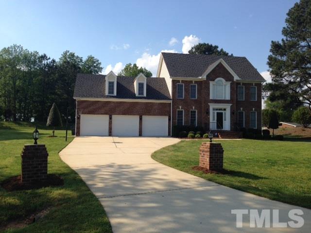 1004 Nortonbridge Road Raleigh, NC 27603 - Photo 1 of 13 a front view of a house with a yard