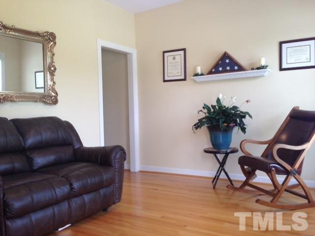 1004 Nortonbridge Road Raleigh, NC 27603 - Photo 3 of 13 a living room with furniture and a potted plant