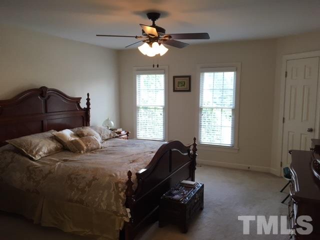1004 Nortonbridge Road Raleigh, NC 27603 - Photo 7 of 13 a bedroom with a bed and window
