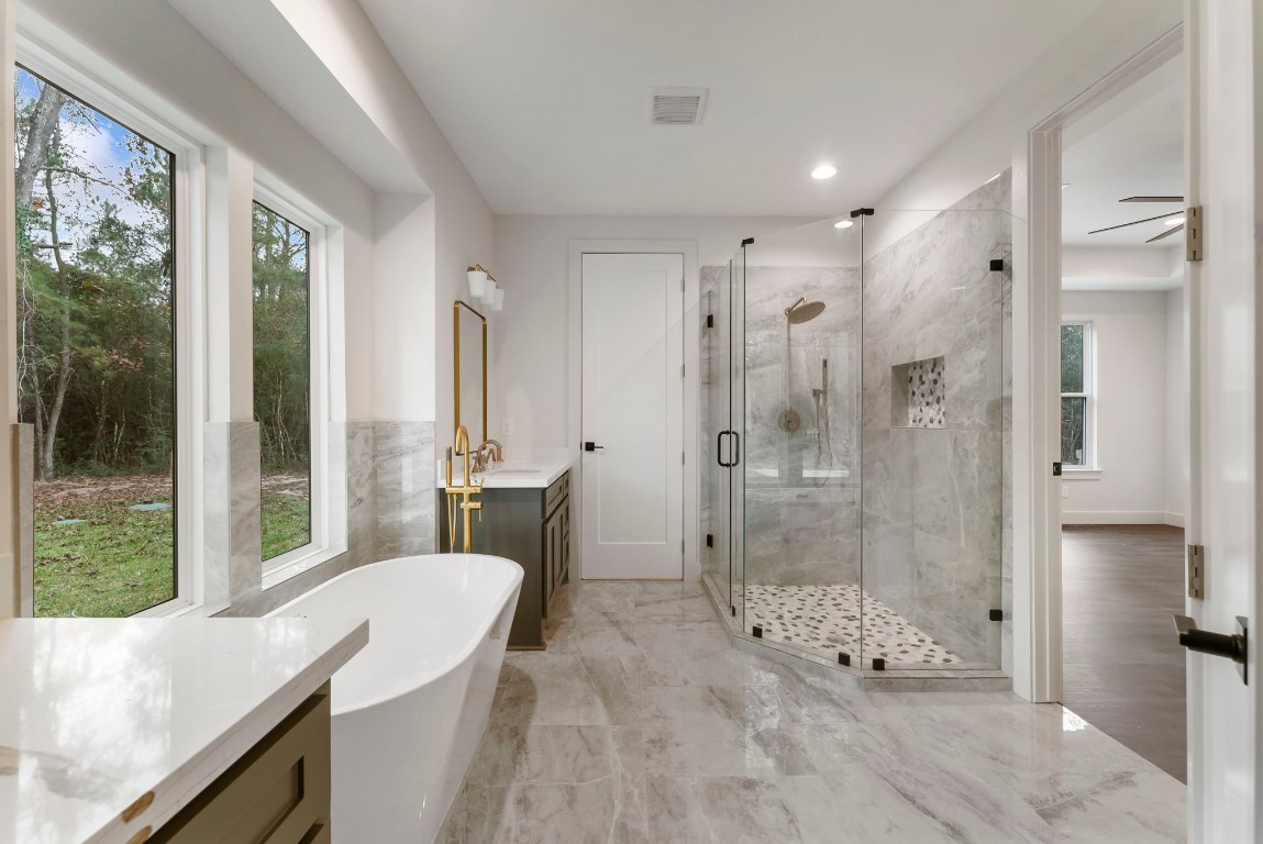 29001 Colin Court Waller, TX 77484 - Photo 22 of 47 a bathroom with a granite countertop sink a toilet and shower