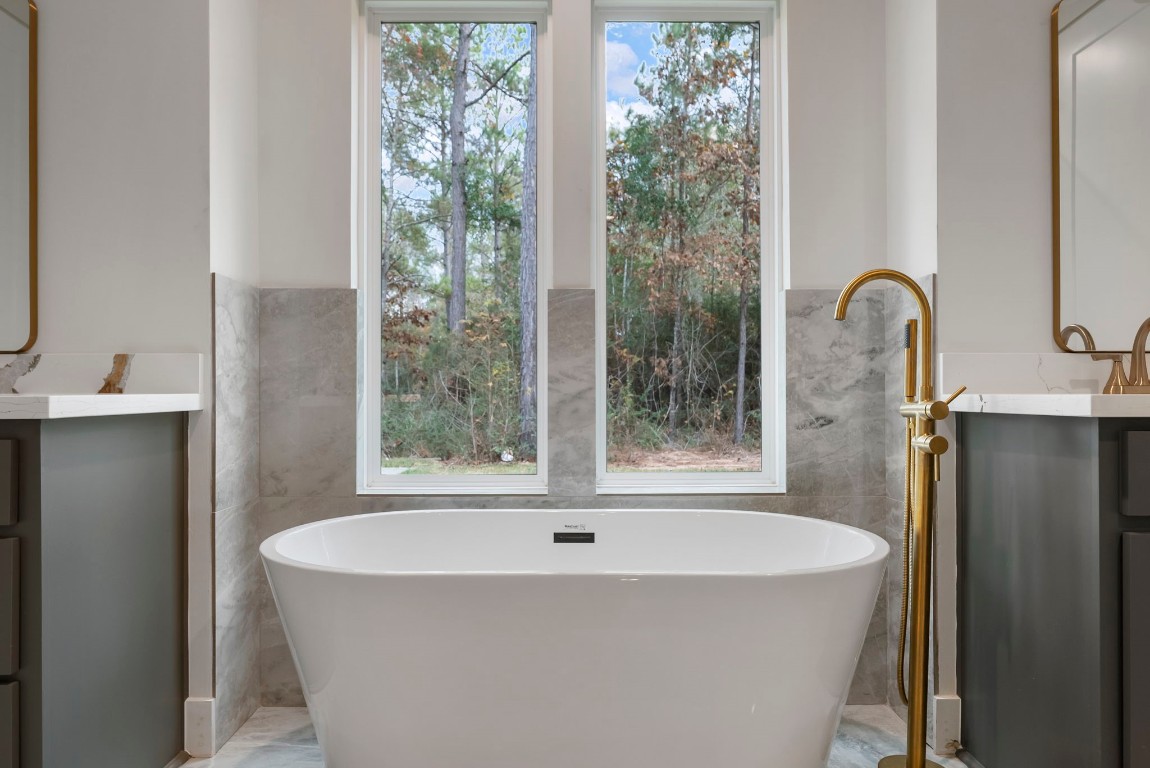 29001 Colin Court Waller, TX 77484 - Photo 24 of 47 a bath tub sitting in a bathroom next to a window