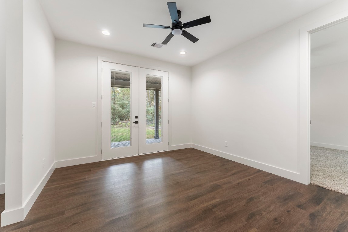 29001 Colin Court Waller, TX 77484 - Photo 26 of 47 an empty room with wooden floor fan and windows