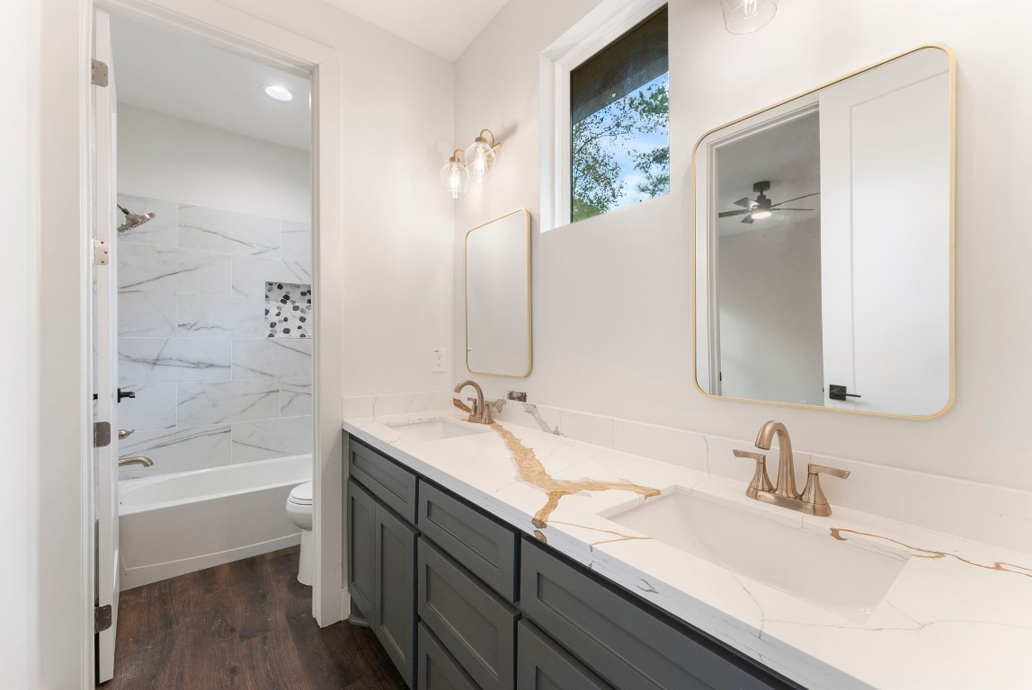 29001 Colin Court Waller, TX 77484 - Photo 30 of 47 a bathroom with a tub a sink and mirrors