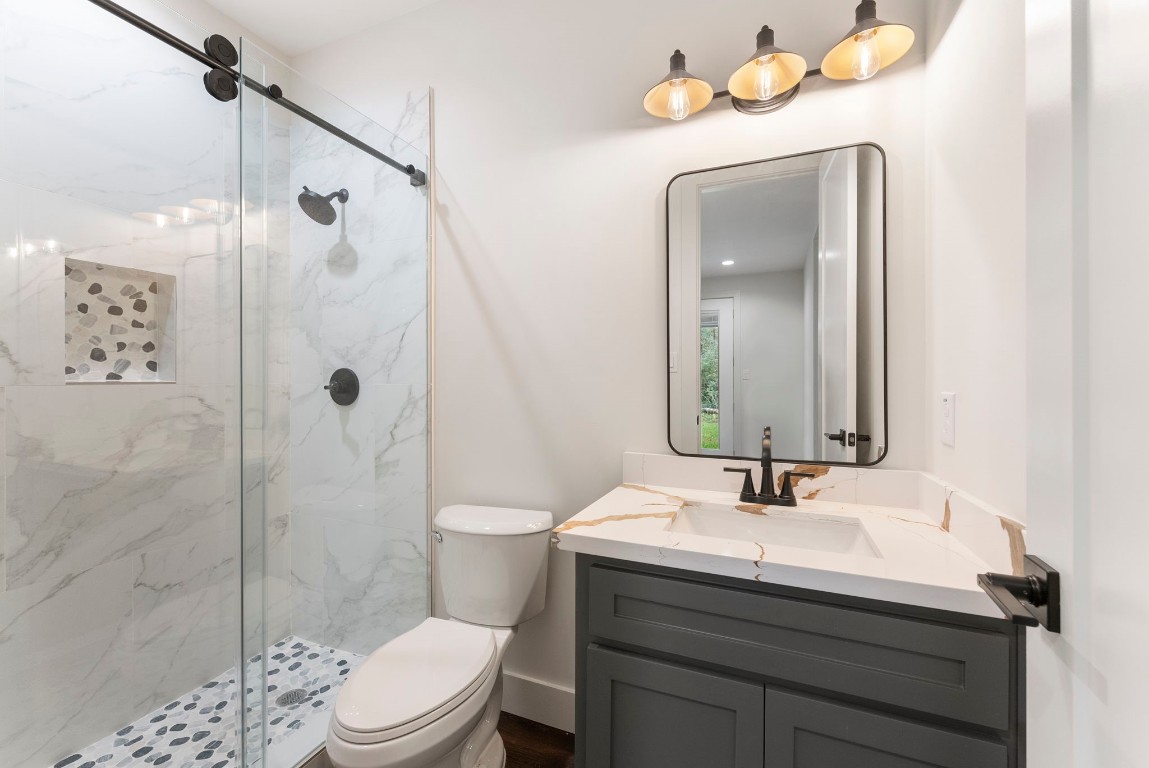 29001 Colin Court Waller, TX 77484 - Photo 31 of 47 a bathroom with a sink toilet a mirror and shower