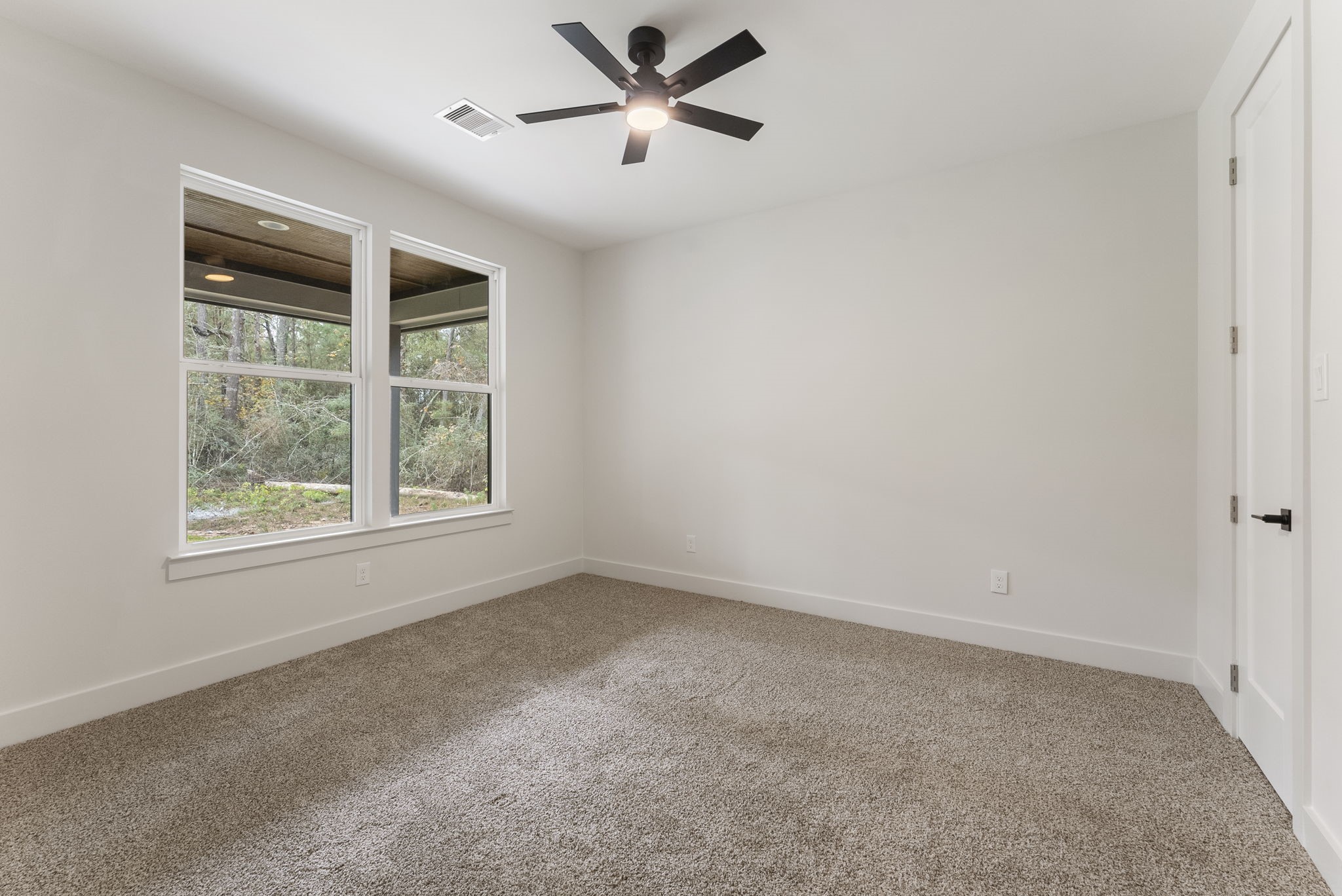 29001 Colin Court Waller, TX 77484 - Photo 32 of 47 Secondary bedroom with views of the back yard.