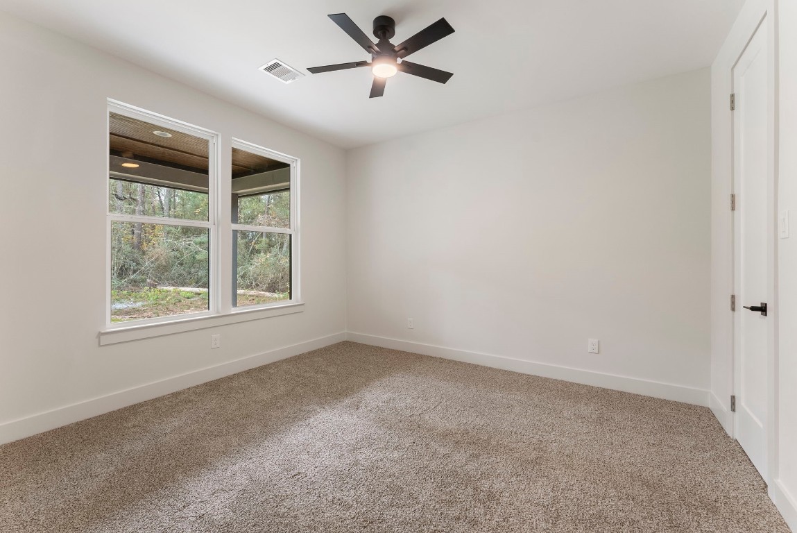 29001 Colin Court Waller, TX 77484 - Photo 32 of 47 Secondary bedroom with views of the back yard.