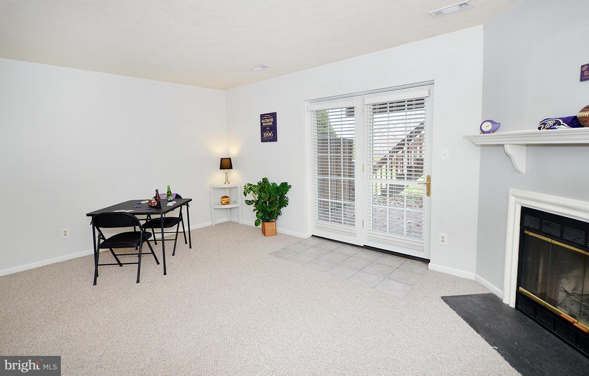 207 Castletown Road Lutherville-Timonium, MD 21093 - Photo 16 of 21 a view of a livingroom with furniture and a fireplace