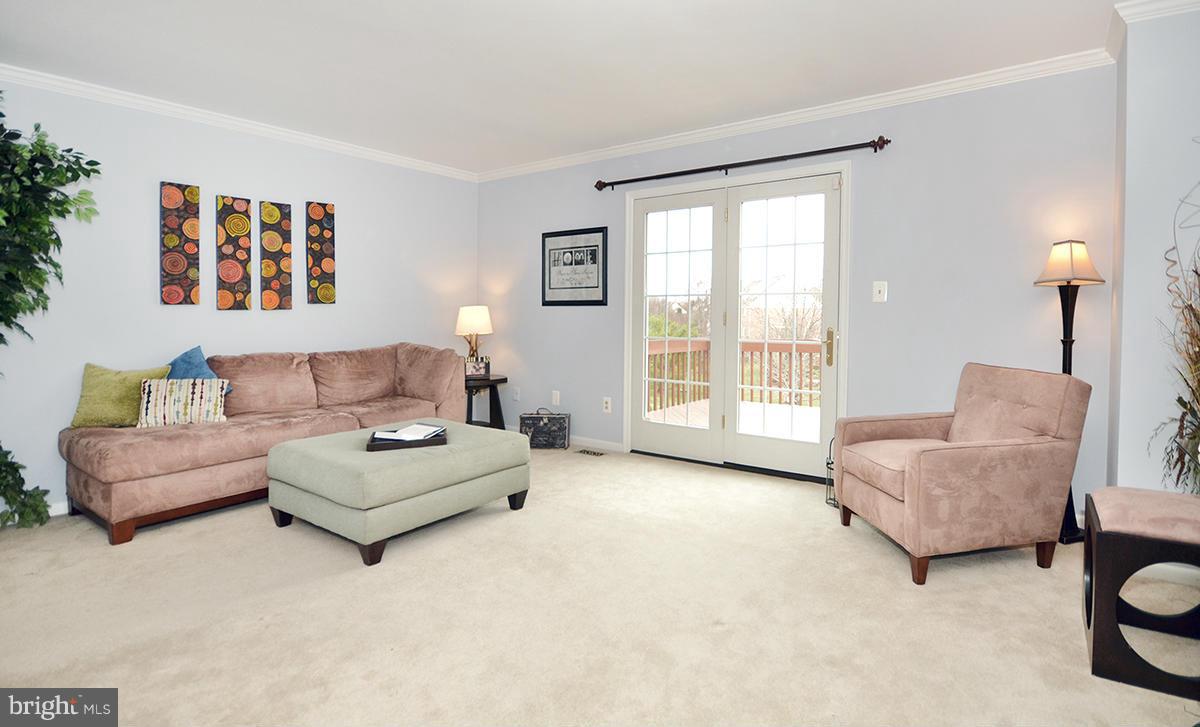 207 Castletown Road Lutherville-Timonium, MD 21093 - Photo 4 of 21 a living room with furniture and a large window