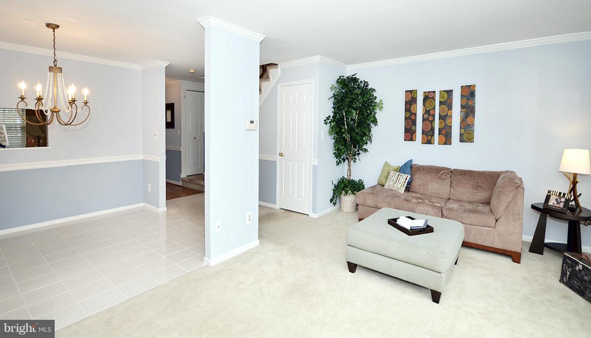 207 Castletown Road Lutherville-Timonium, MD 21093 - Photo 5 of 21 a living room with furniture and a chandelier