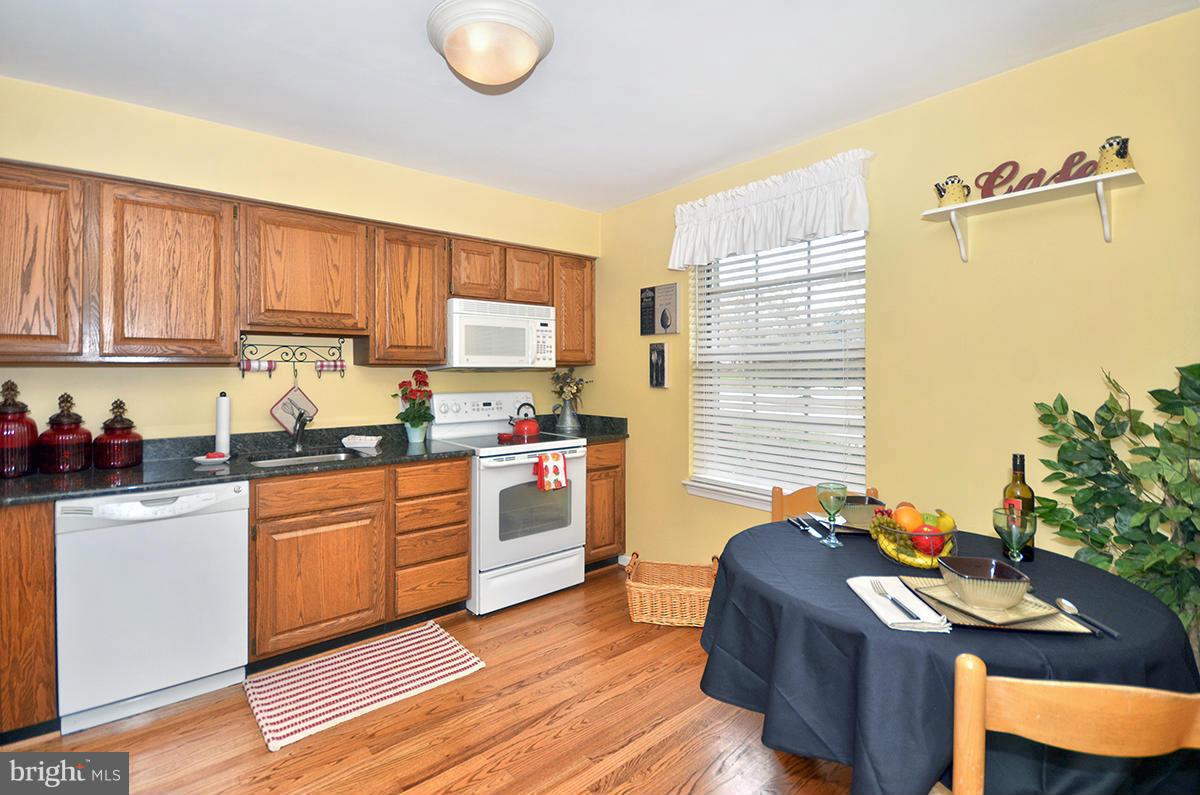 207 Castletown Road Lutherville-Timonium, MD 21093 - Photo 6 of 21 a kitchen with a sink appliances cabinets and a window