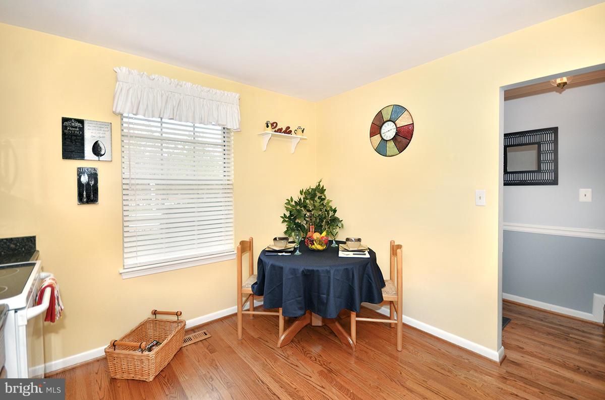 207 Castletown Road Lutherville-Timonium, MD 21093 - Photo 8 of 21 a view of a workspace with furniture and wooden floor