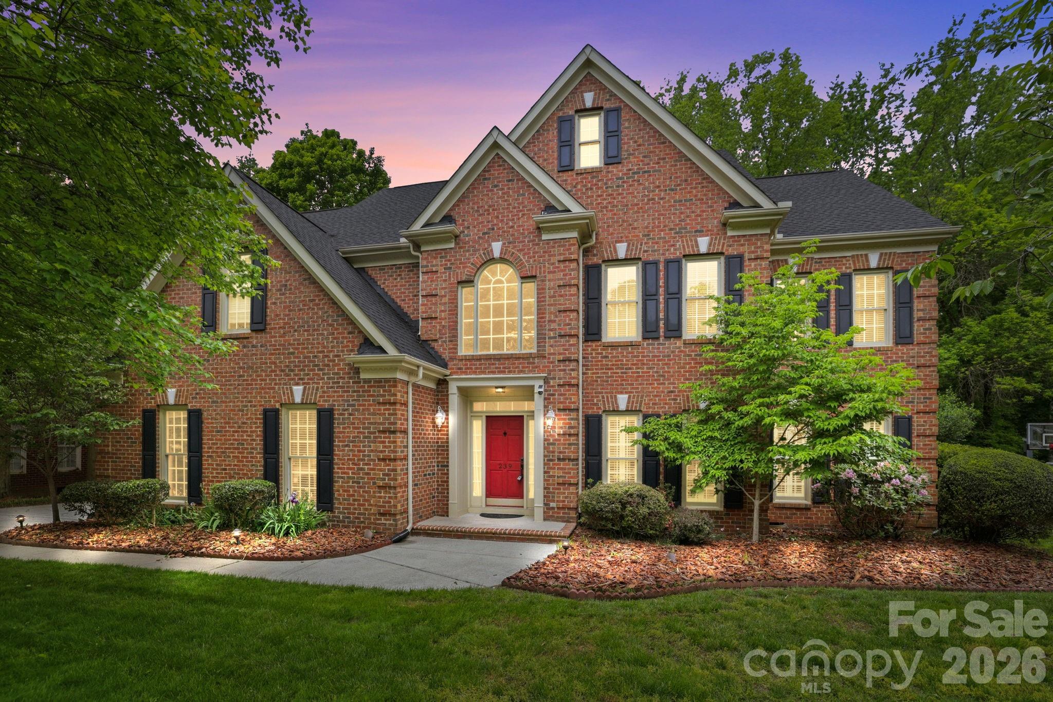 239 Sardis Pointe Road Matthews, NC 28105 - Photo 1 of 47 front view of a house with a yard