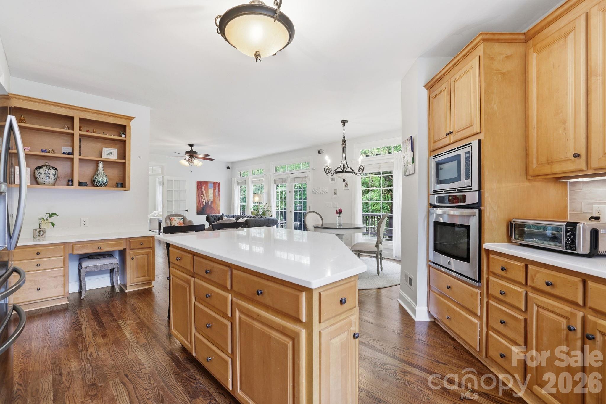 239 Sardis Pointe Road Matthews, NC 28105 - Photo 13 of 47 a kitchen with stainless steel appliances granite countertop a kitchen island a stove and a sink