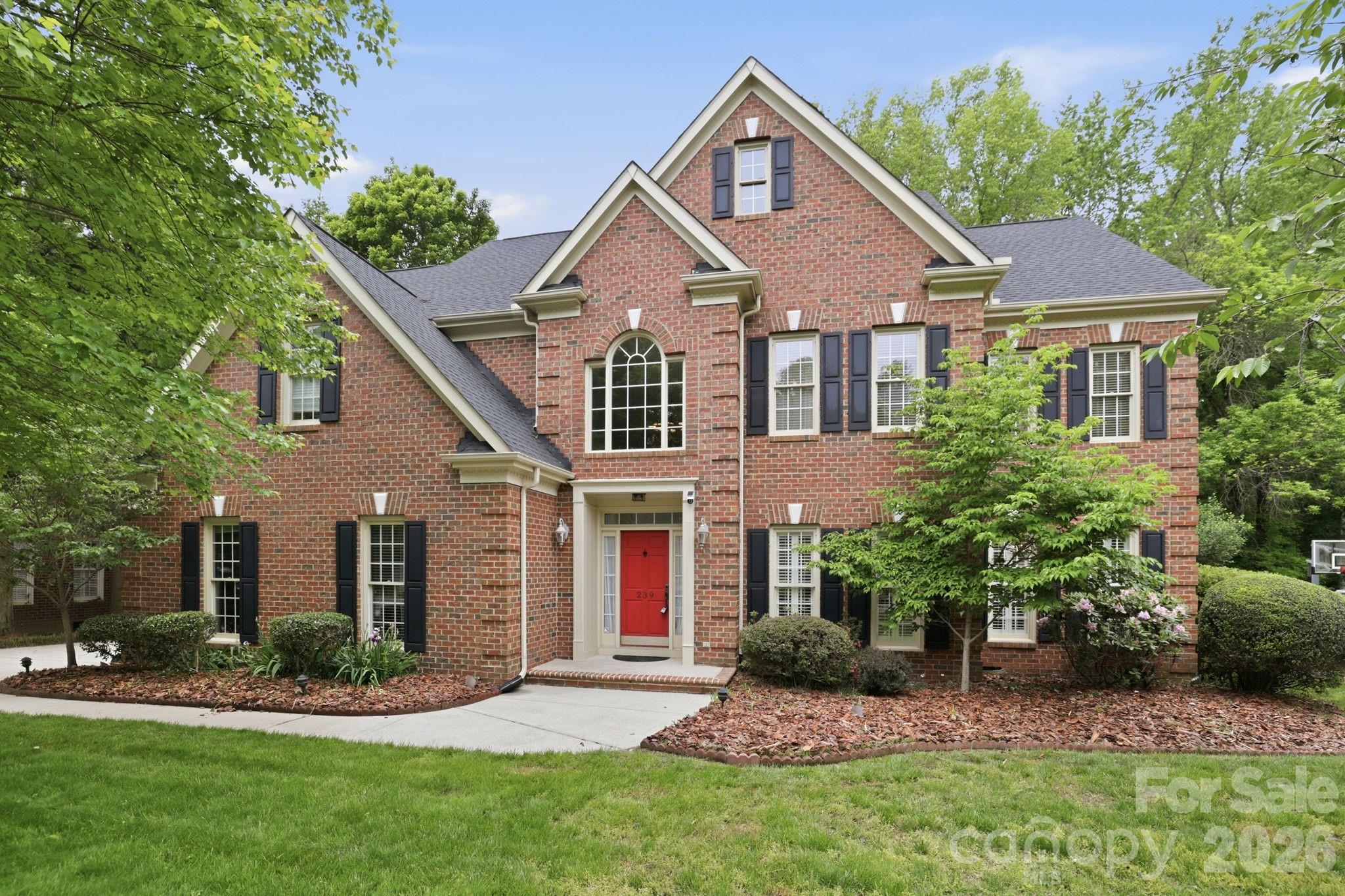 239 Sardis Pointe Road Matthews, NC 28105 - Photo 2 of 47 front view of a house with a yard