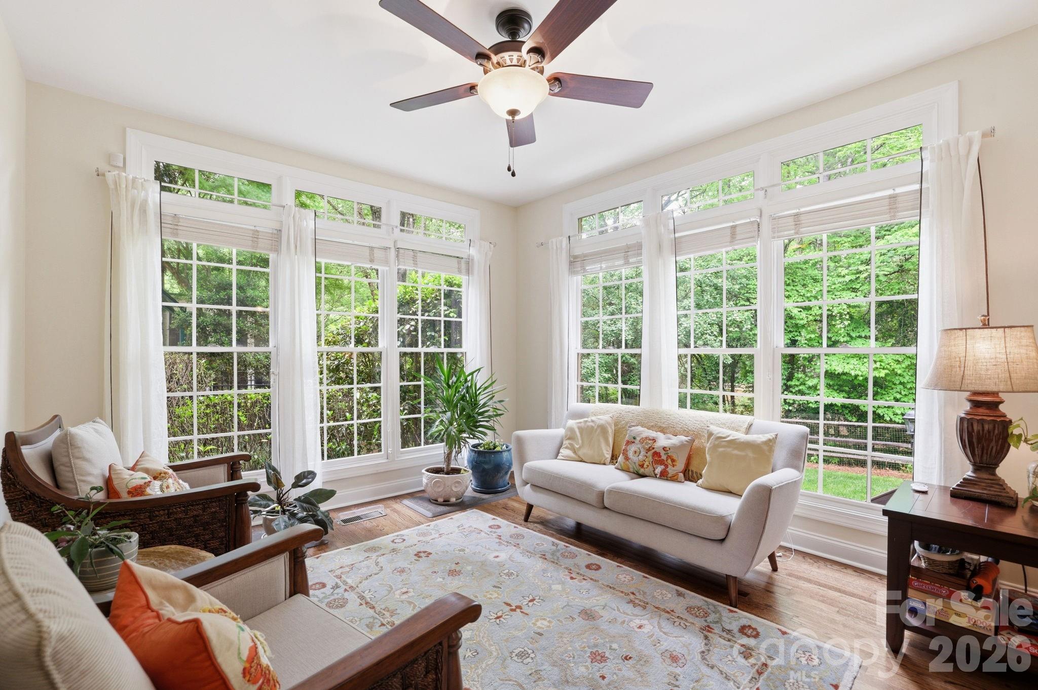 239 Sardis Pointe Road Matthews, NC 28105 - Photo 21 of 47 a living room with furniture and a large window