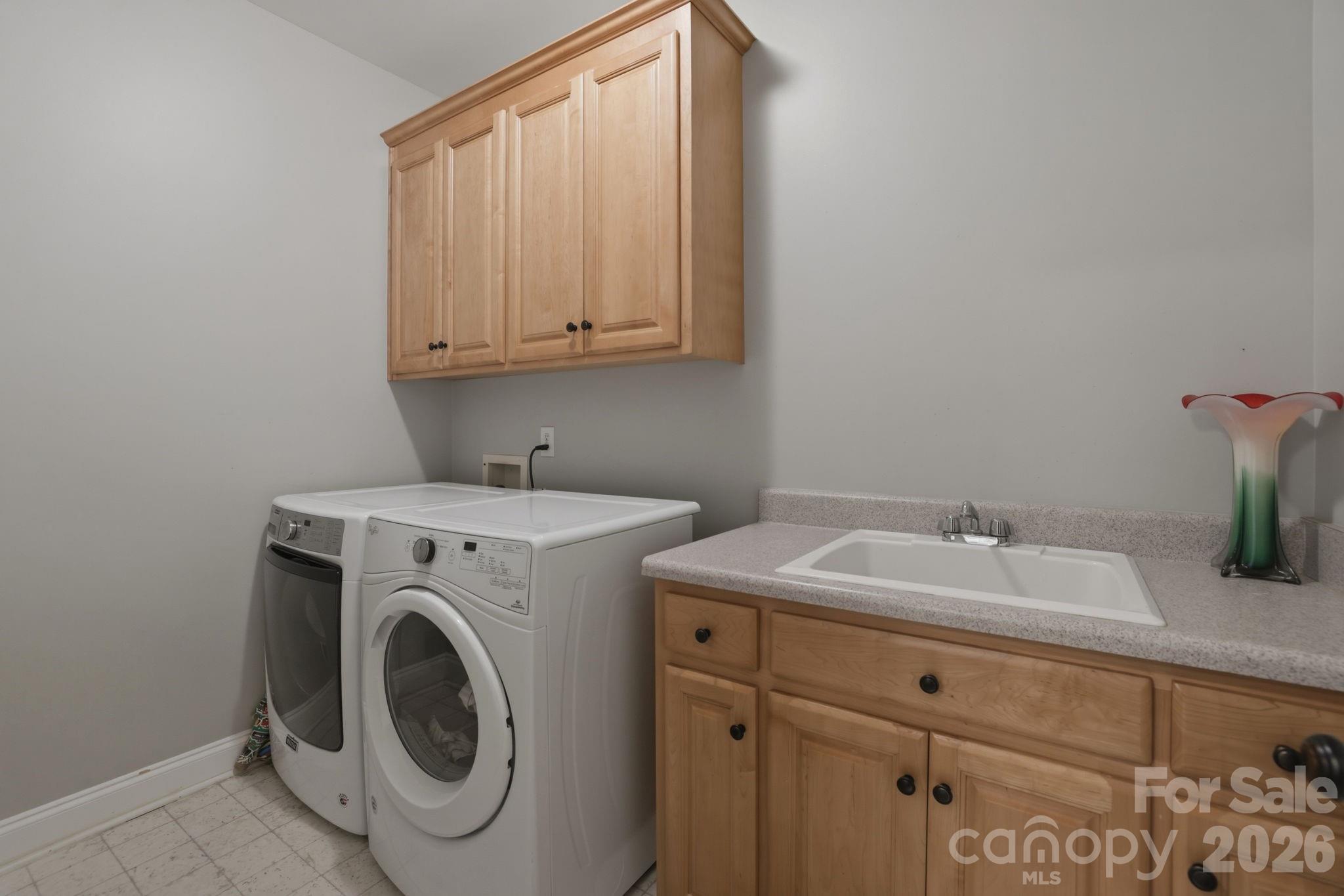 239 Sardis Pointe Road Matthews, NC 28105 - Photo 23 of 47 a utility room with dryer and washer