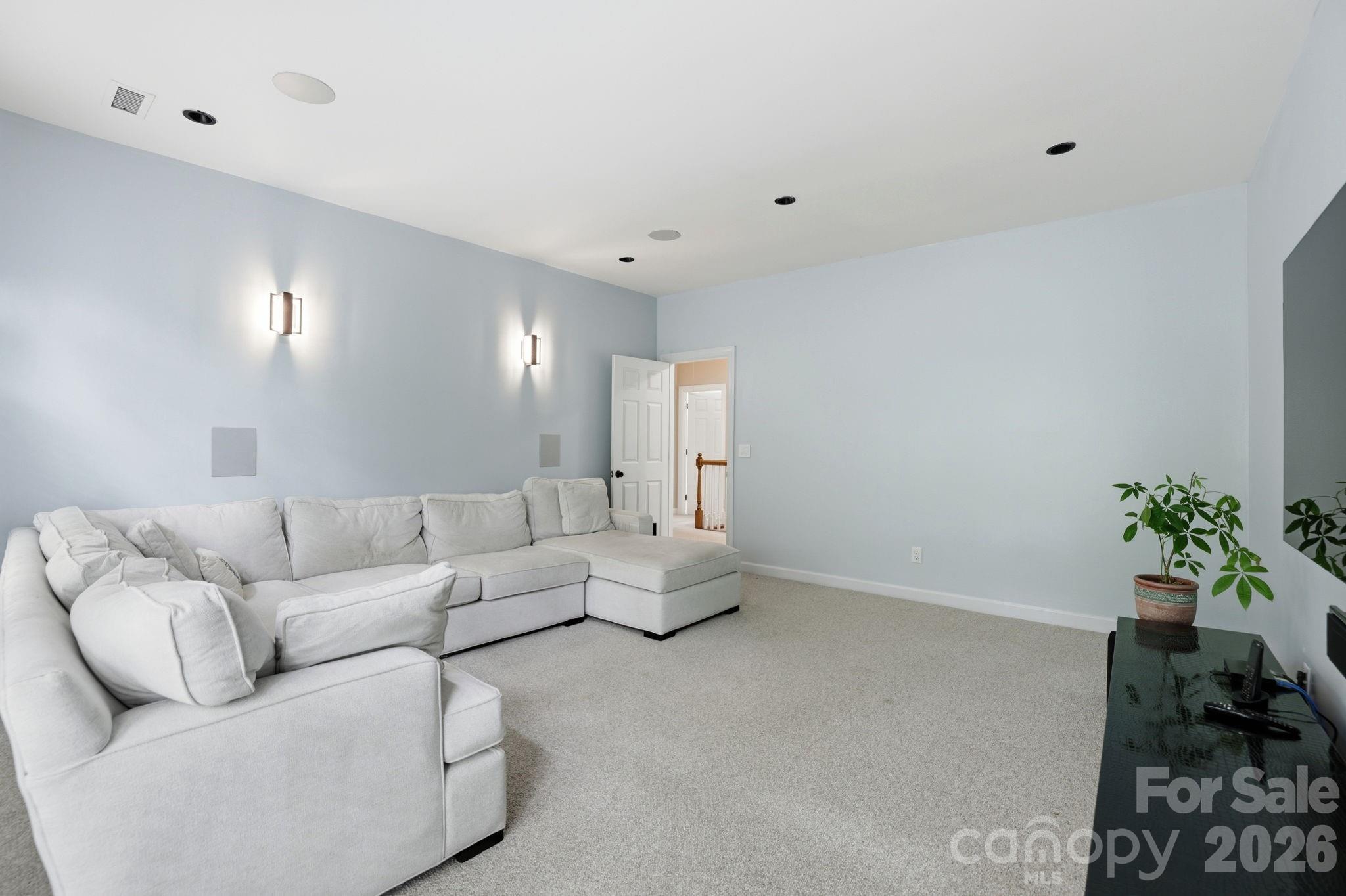 239 Sardis Pointe Road Matthews, NC 28105 - Photo 25 of 47 a living room with furniture and flowers