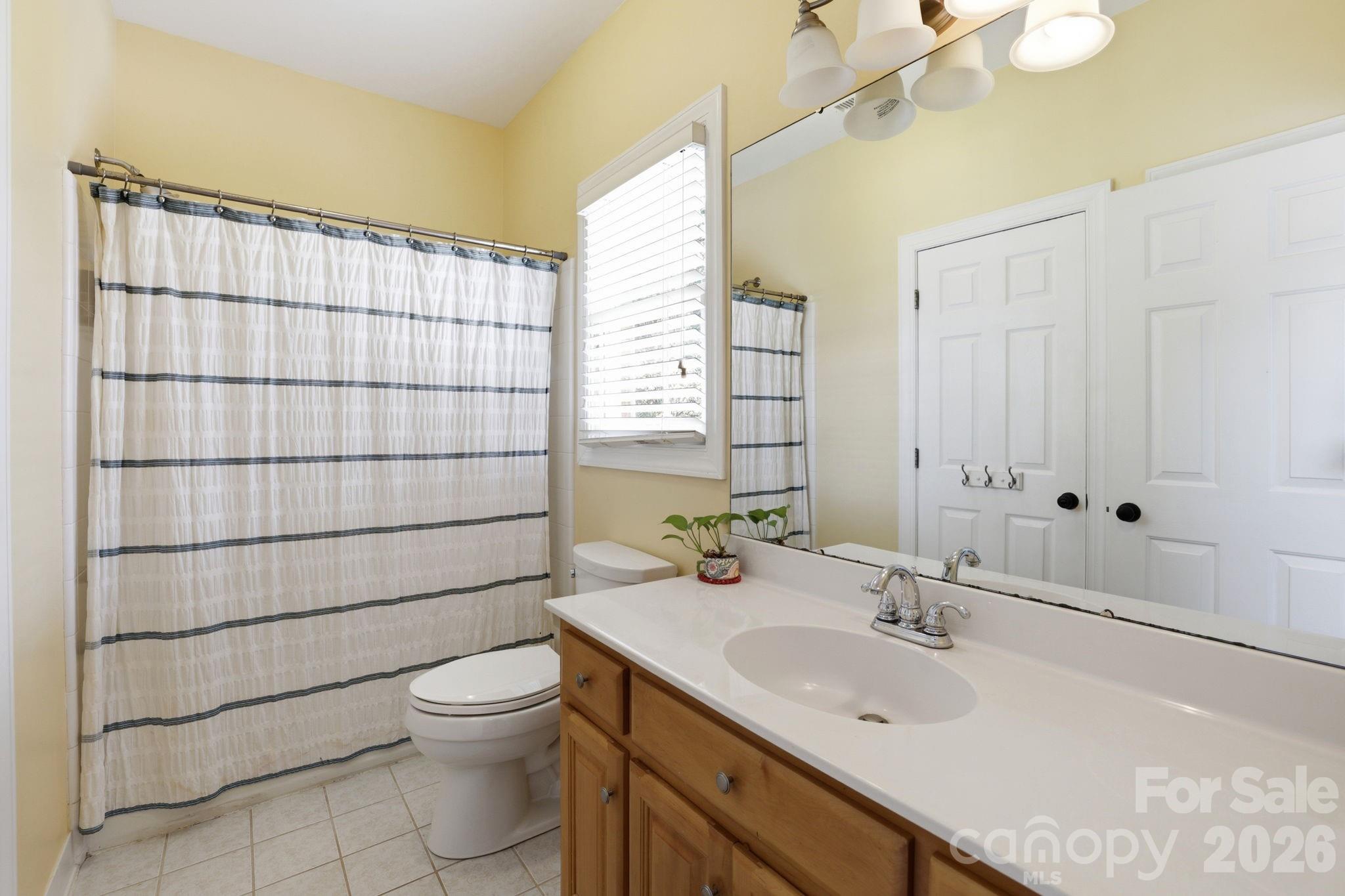 239 Sardis Pointe Road Matthews, NC 28105 - Photo 28 of 47 a bathroom with a sink a toilet and shower