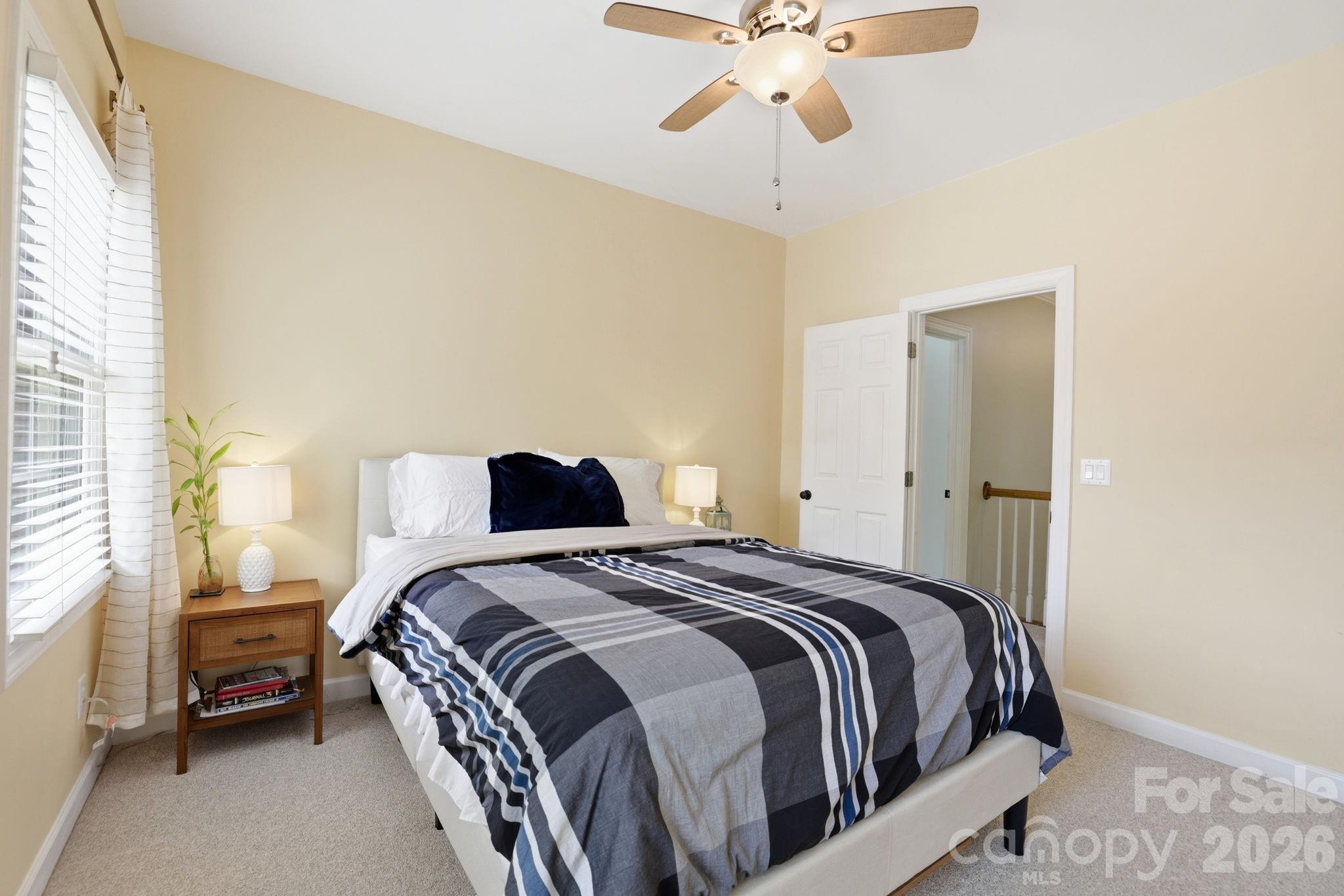 239 Sardis Pointe Road Matthews, NC 28105 - Photo 29 of 47 a bedroom with a bed and window