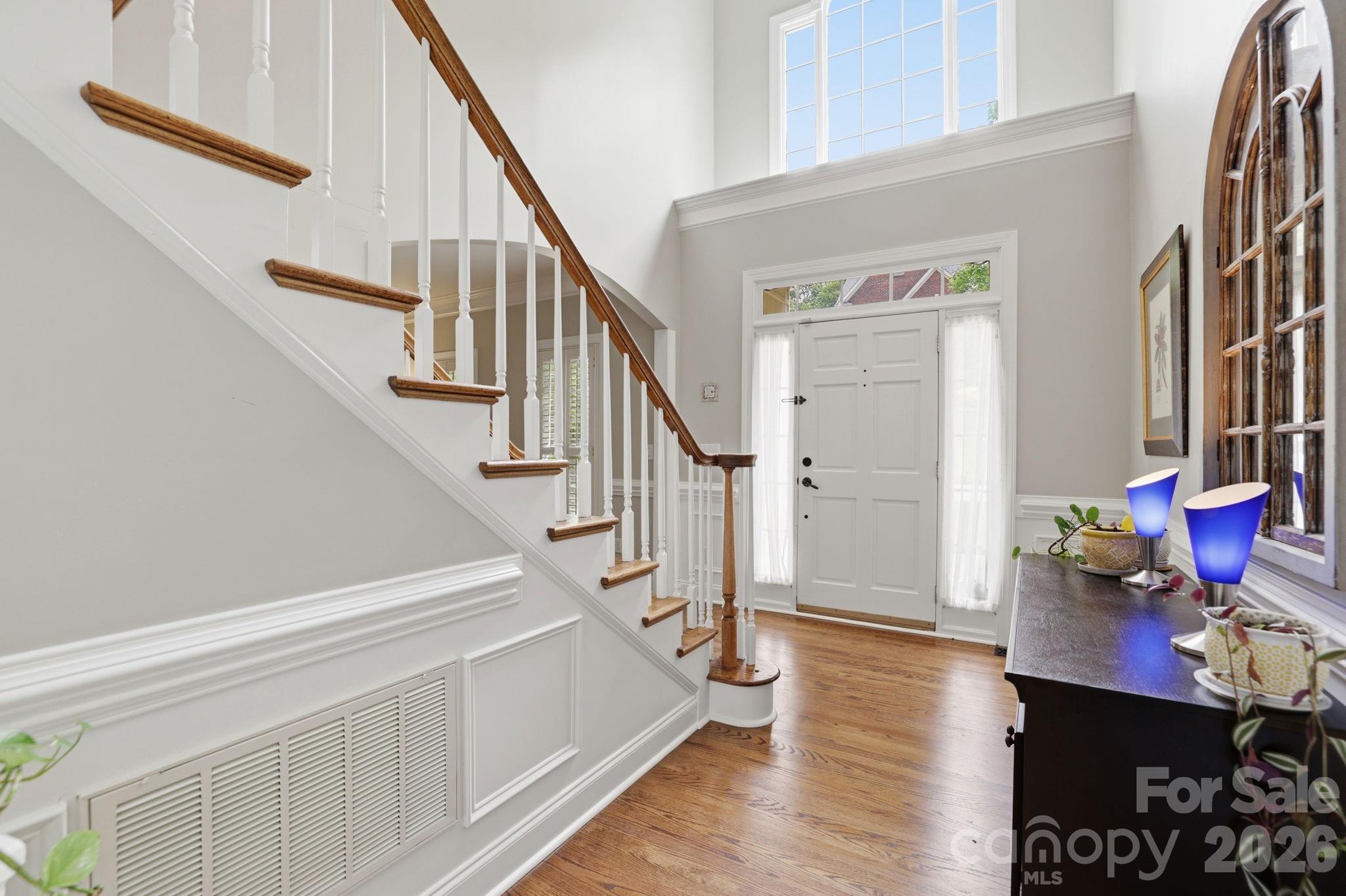 239 Sardis Pointe Road Matthews, NC 28105 - Photo 3 of 47 a view of entryway and hall with wooden floor