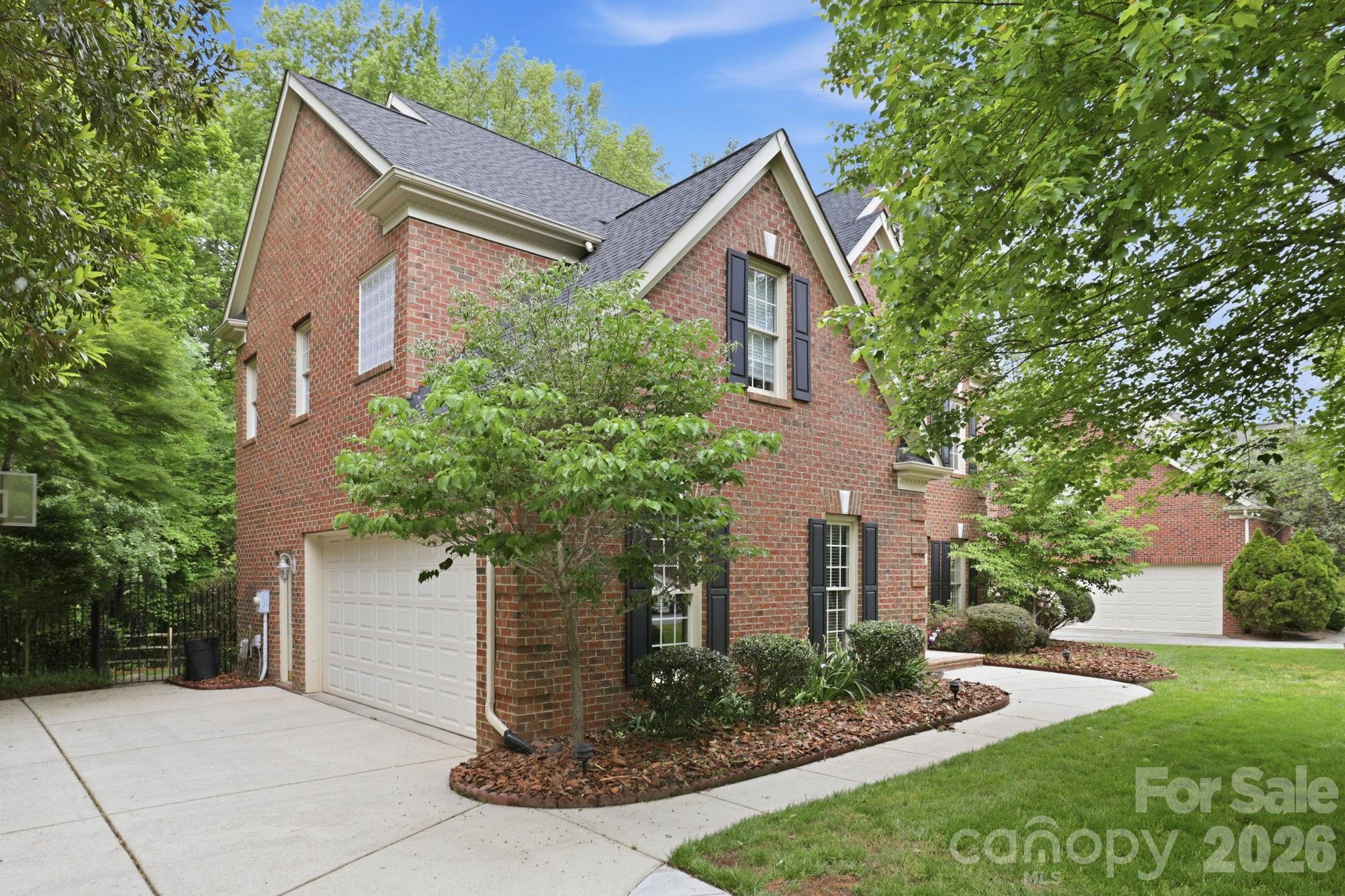 239 Sardis Pointe Road Matthews, NC 28105 - Photo 36 of 47 a front view of a house with garden
