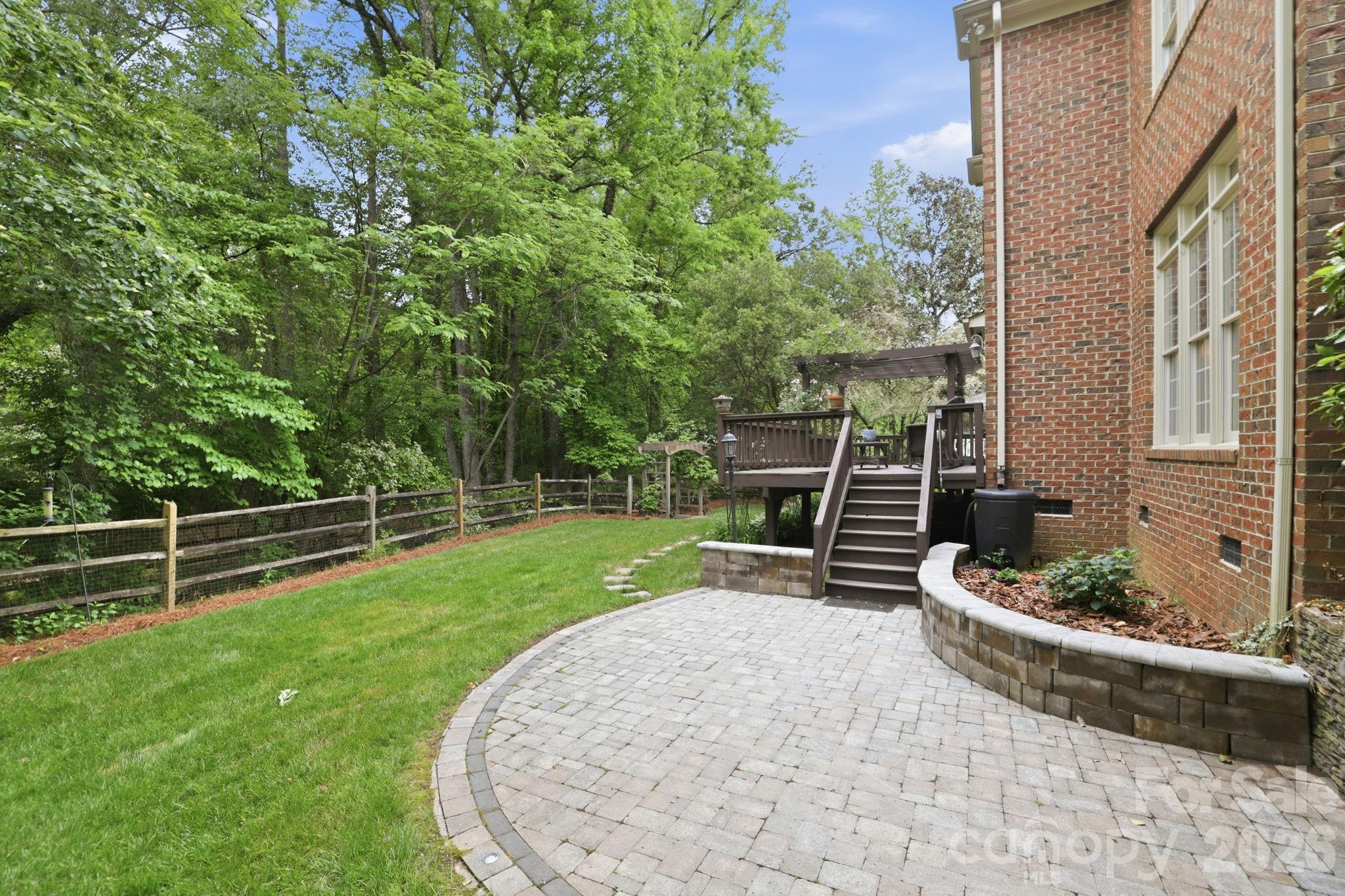 239 Sardis Pointe Road Matthews, NC 28105 - Photo 42 of 47 a backyard of a house with lots of green space