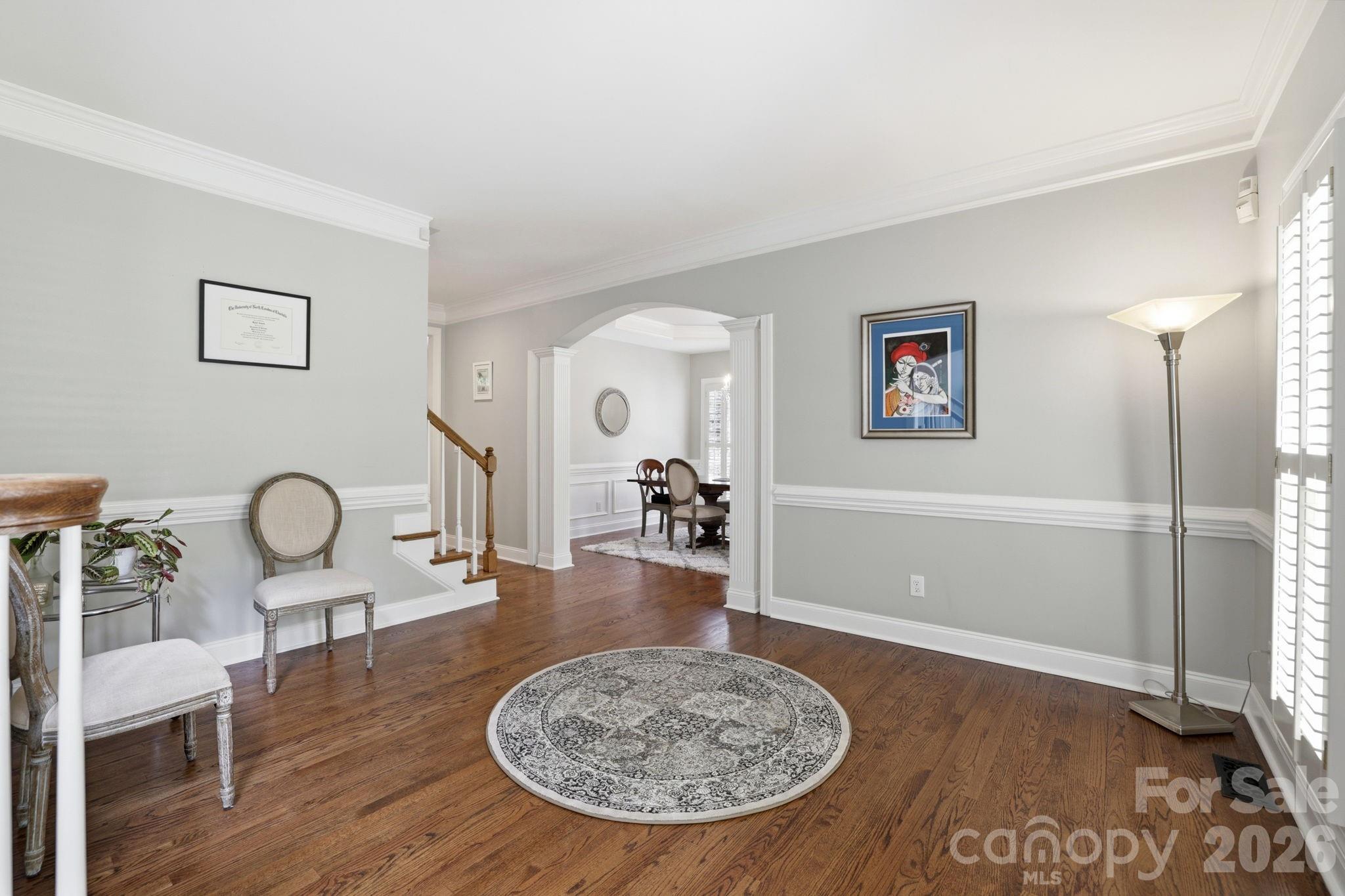 239 Sardis Pointe Road Matthews, NC 28105 - Photo 5 of 47 a view of a livingroom with furniture and wooden floor
