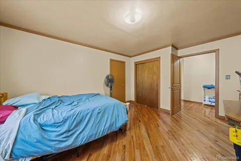 a bedroom with a bed and a dresser