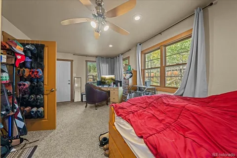 a bed room with a bed and a window