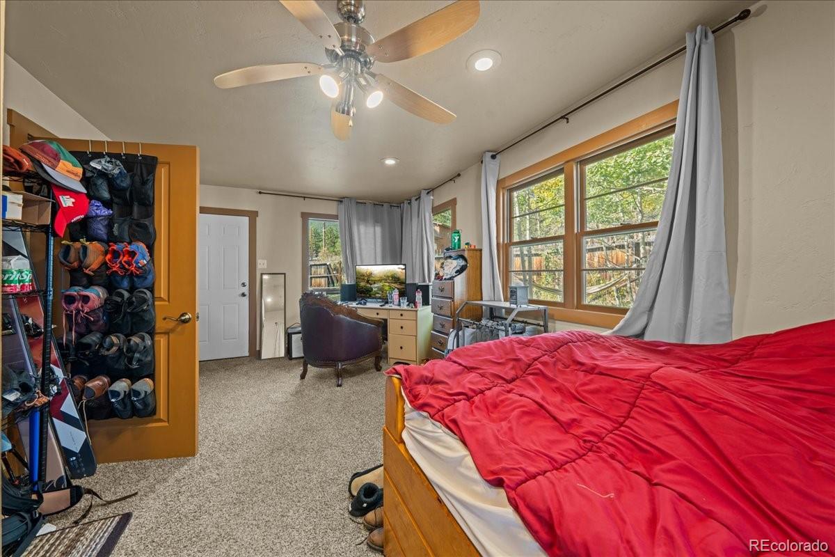 40 Ski Road Allenspark, CO 80510 - Photo 25 of 46 a bed room with a bed and a window