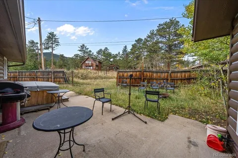 a view of a chairs and table in patio