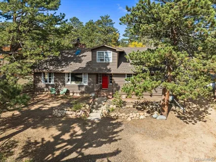 a view of a house with a tree