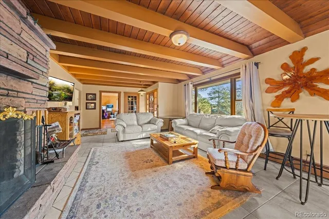a living room with patio furniture and a window