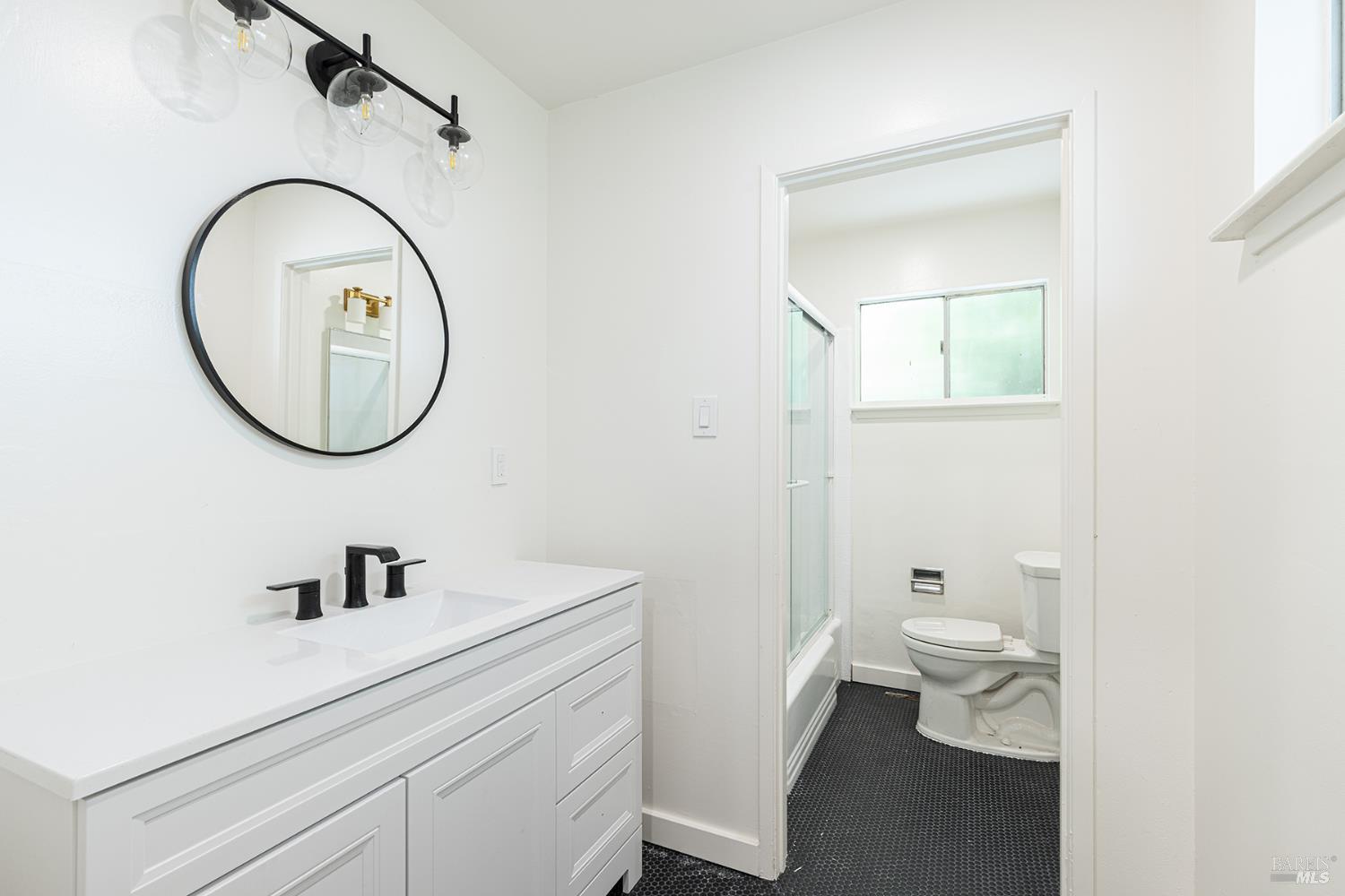 157 Homestead Boulevard Mill Valley, CA 94941 - Photo 11 of 20 a bathroom with a sink a toilet and a mirror