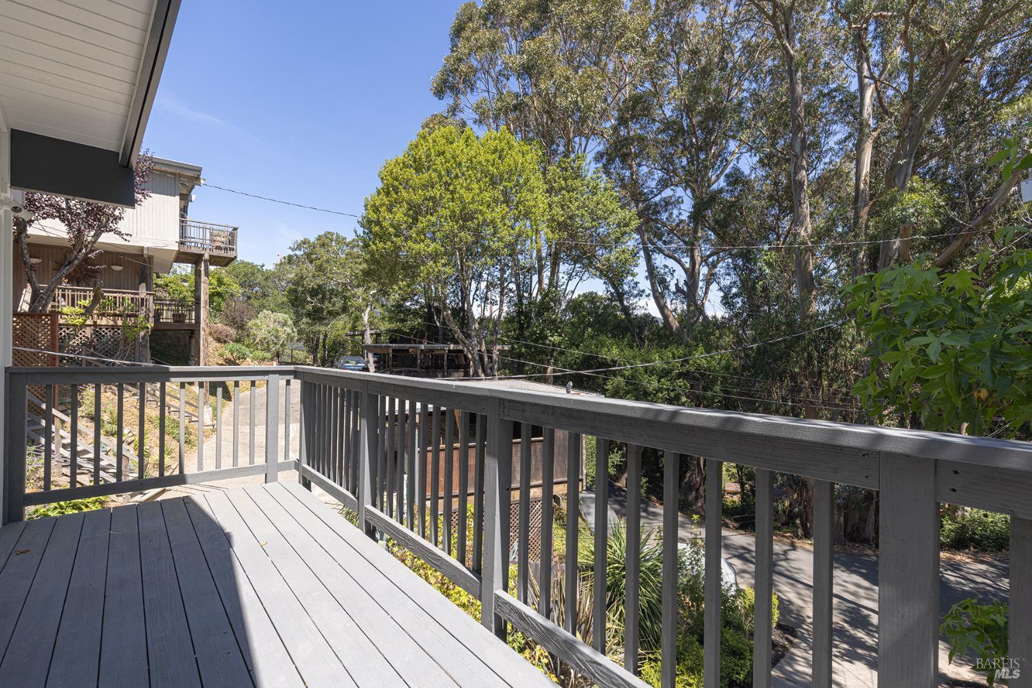 157 Homestead Boulevard Mill Valley, CA 94941 - Photo 13 of 20 a balcony with wooden floor and fence