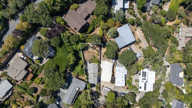 an aerial view of residential house with outdoor space and parking