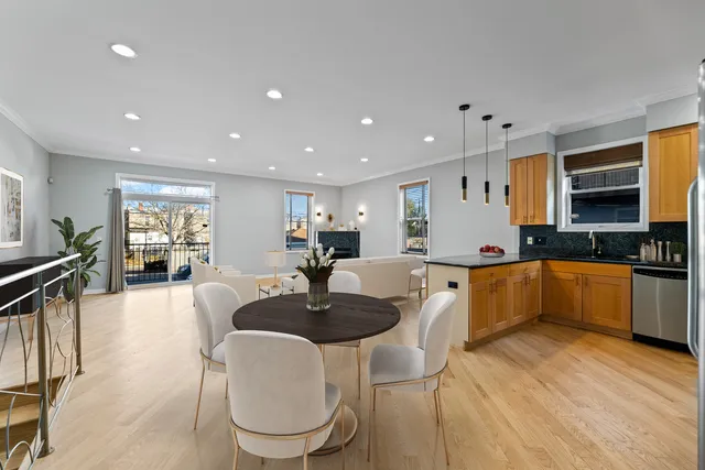 a living room with fireplace furniture and a fireplace
