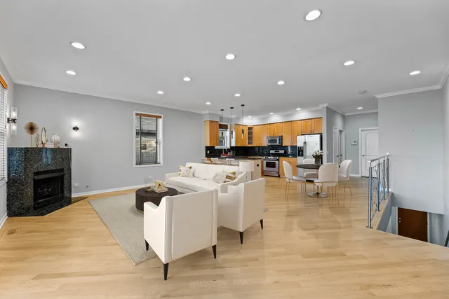 a spacious bedroom with a bed and a potted plant