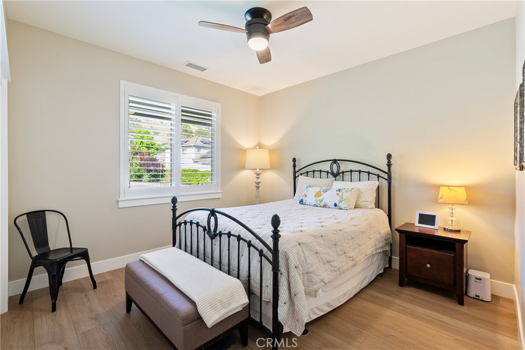 8550 El Corte Road Atascadero, CA 93422 - Photo 38 of 72 Bedroom 4 sits at the front of the home and features a ceiling fan, luxury vinyl plank flooring and plantation shutters.