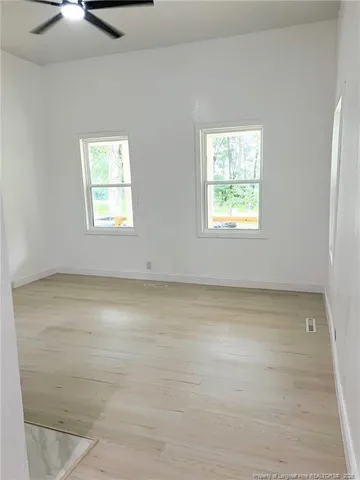 a view of an entryway with wooden floor