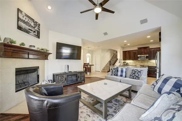 a living room with furniture and a fireplace