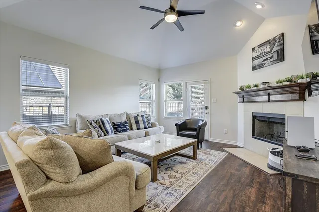 a living room with furniture fireplace and window