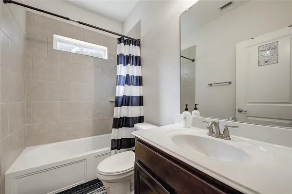 a bathroom with a sink a toilet and a bathtub