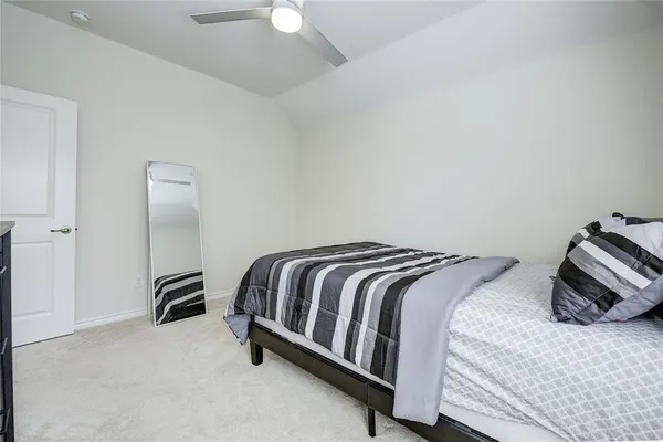 a bedroom with a bed and a closet