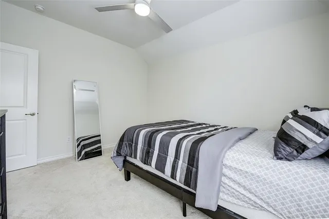 a bedroom with a bed and a closet