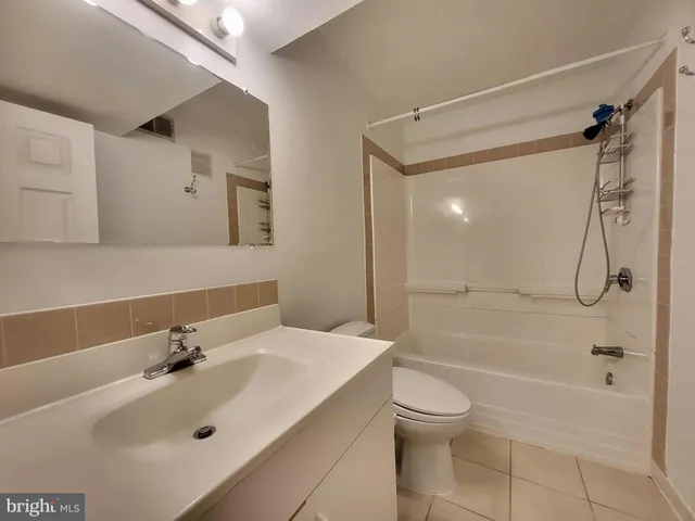 a view of a house with a yard and tree s